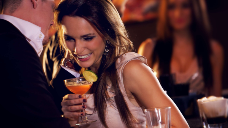 Man and woman flirting with each other at a bar