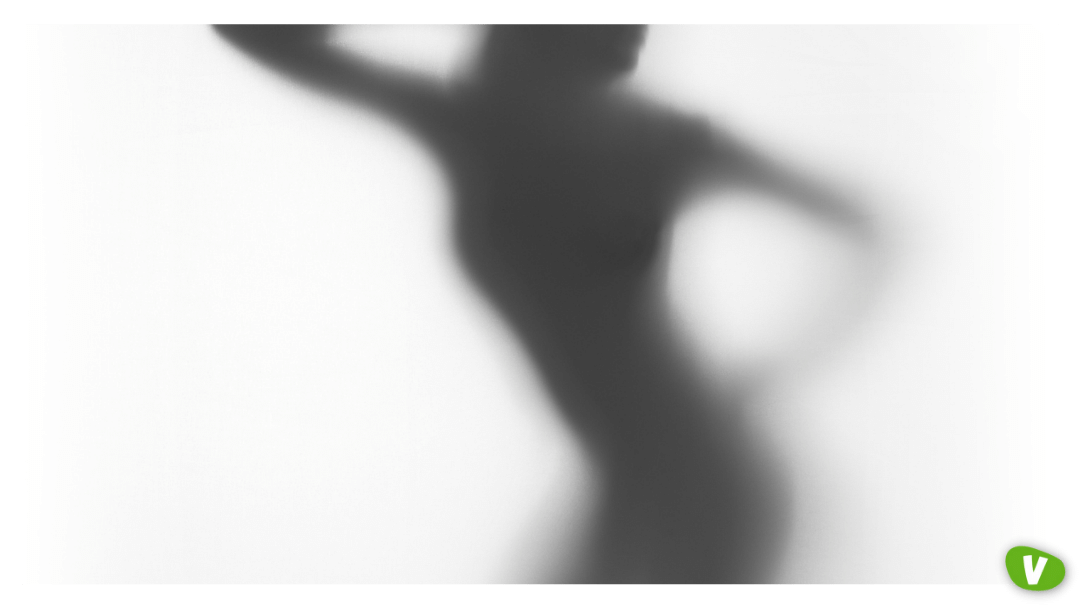 female body silhouette behind a curtain