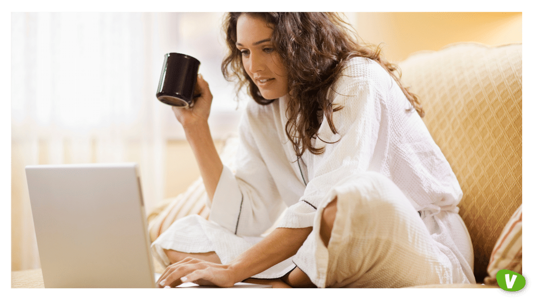 Woman working at home with laptop computer⁠