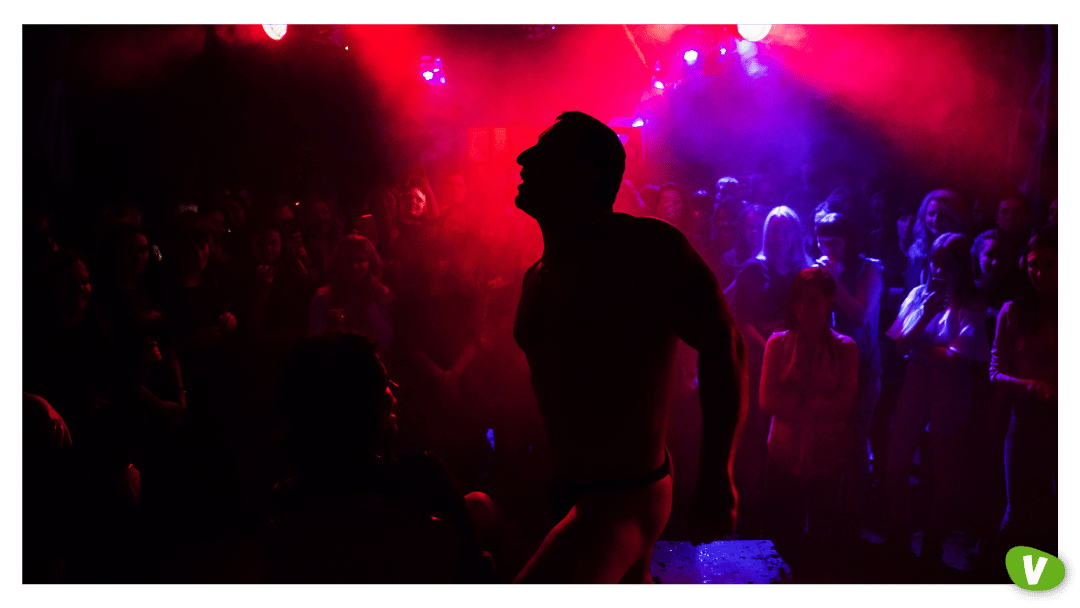 Silhouette of a Male Stripper Performing on Stage