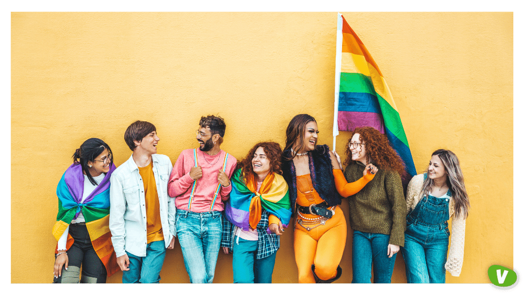 Diverse Group of People with LGBT Flags Celebrating Pride