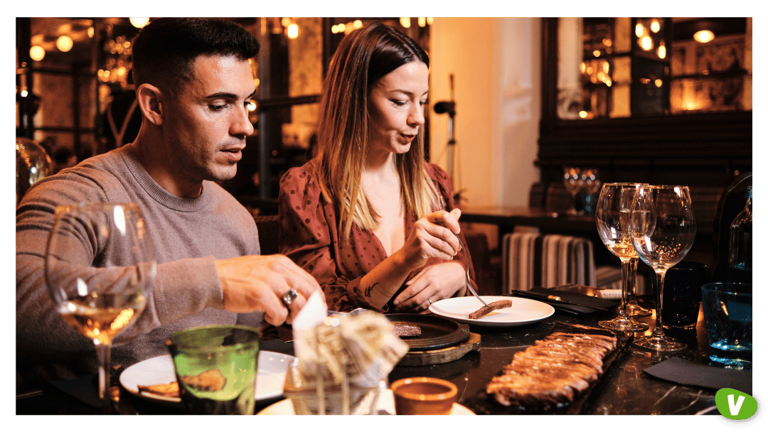 Young Couple Having Dinner Together at Restaurant⁠