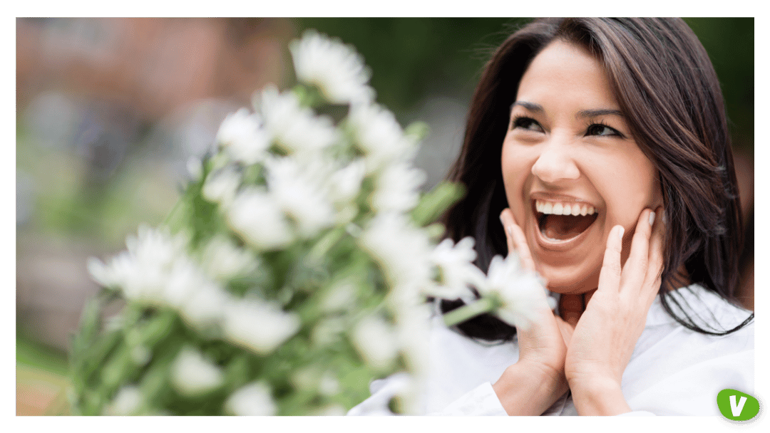 Surprised woman getting flowers