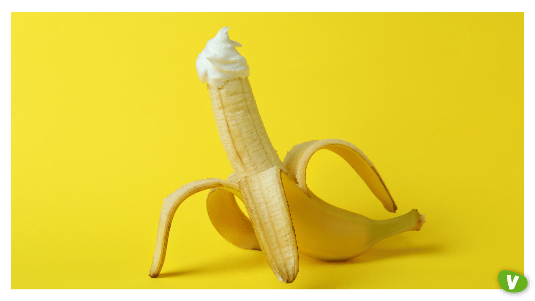 Banana with Whipped Cream on Yellow Background