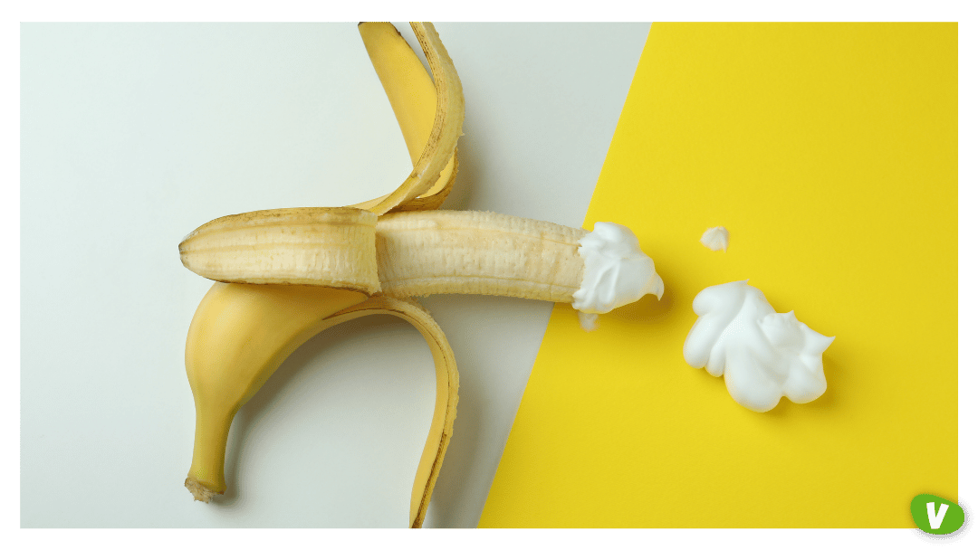 Banana with Whipped Cream on Two Tone Background