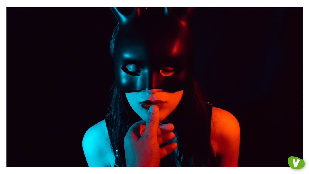 man touches the lips of a sexy submissive girl in a Bunny mask