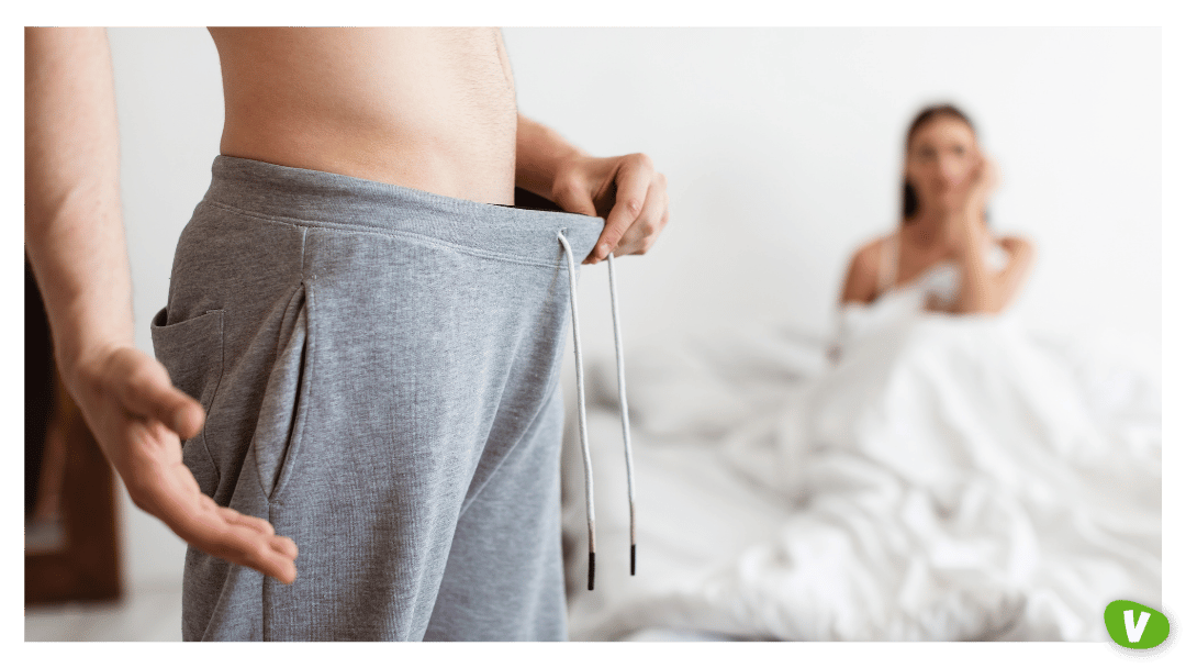 Man Looking In Pants While Woman Waiting In Bed, Cropped