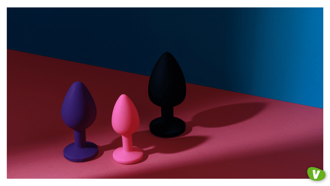 Different colored buttplug sex toy with contrast shadows. Anal toys for adult. Sex shop concept