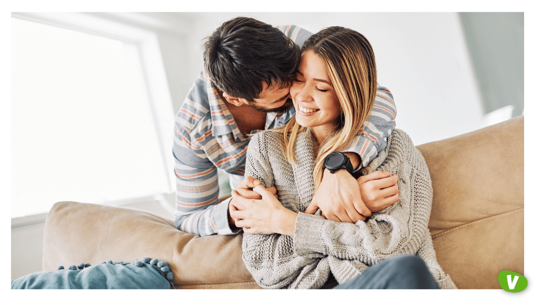 young couple hugging on the sofa